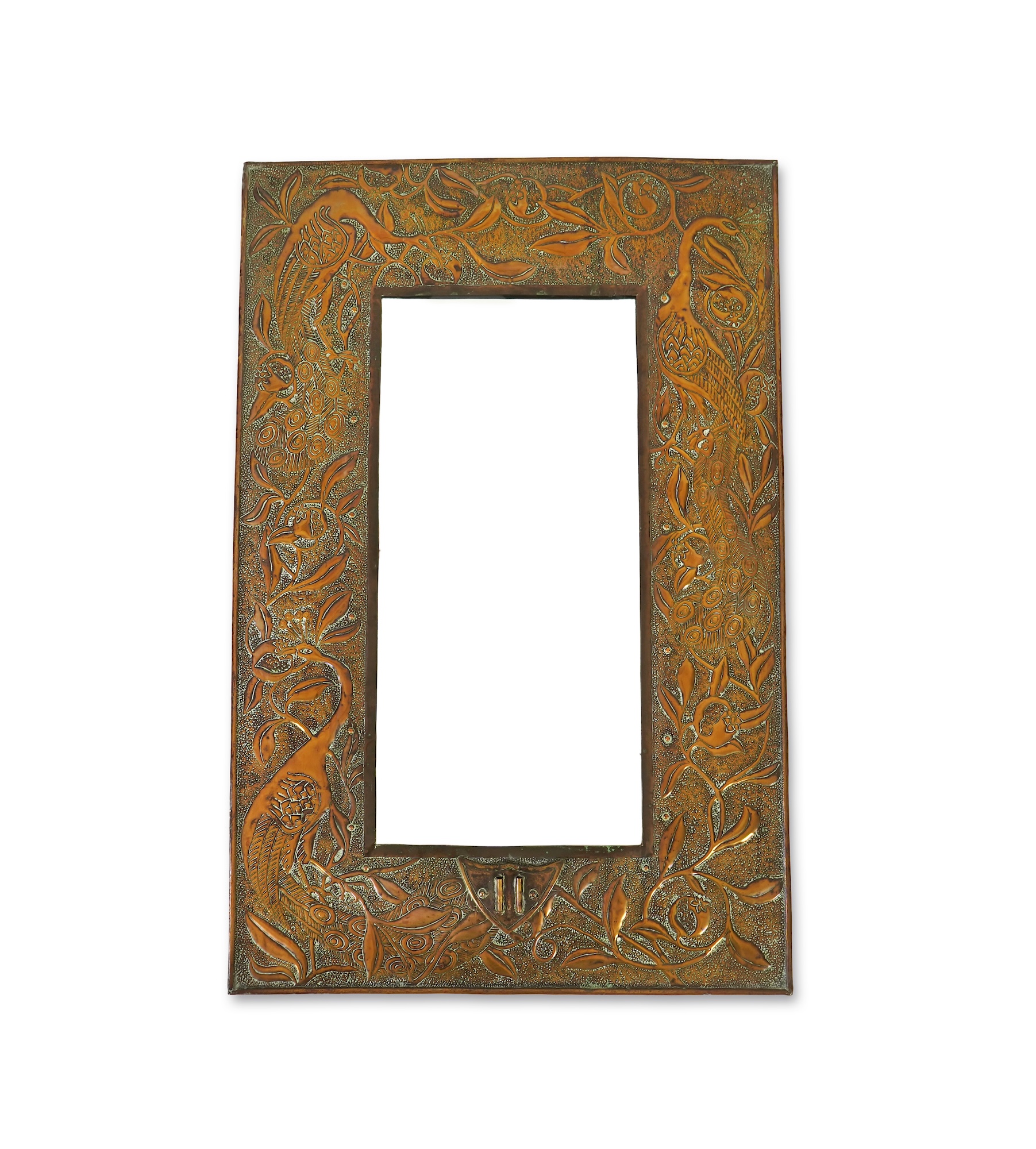 An Arts and Crafts embossed copper mirror, manner of Talwin Morris, Glasgow School